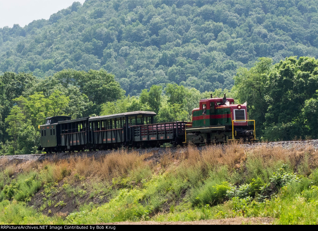 EBT m-7 and the excursion train northbound on the long fill.